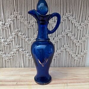 Vintage Avon cobalt blue glass decanter from the 1970s.